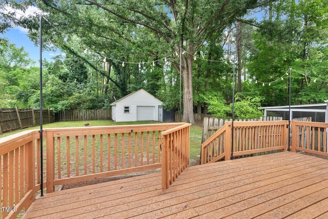 1826 Northgate St, Durham, NC 27704 - wooden deck featuring a garage, an outbuilding, and view of wooded area