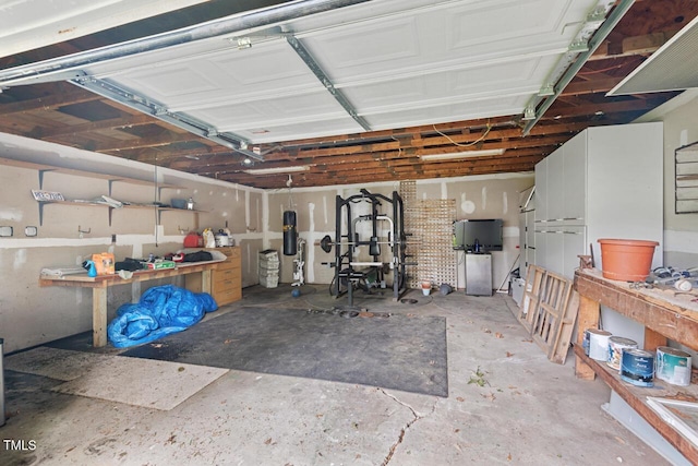 1826 Northgate St, Durham, NC 27704 - garage with a workshop area and a central vacuum unit
