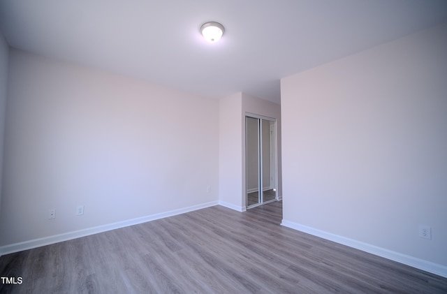 8021 Wesley Farm Dr, Raleigh, NC 27616 - unfurnished room featuring wood finished floors and baseboards