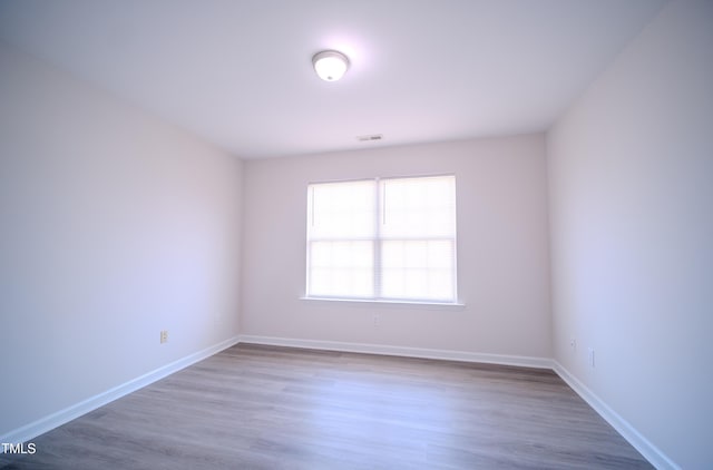 8021 Wesley Farm Dr, Raleigh, NC 27616 - spare room with wood finished floors and baseboards