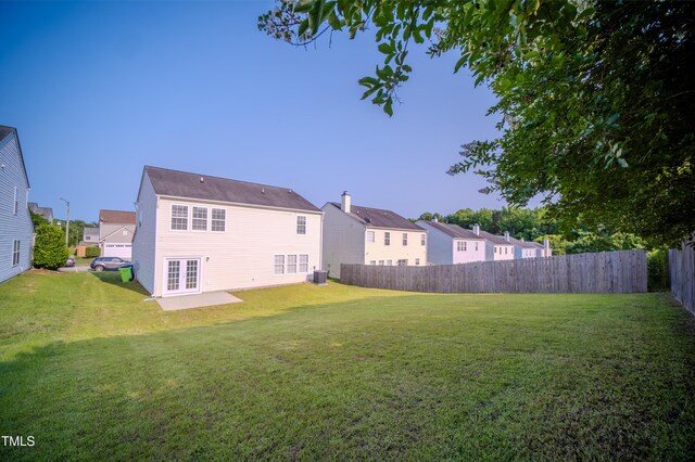 8021 Wesley Farm Dr, Raleigh, NC 27616 - rear view of property with french doors, cooling unit, and a residential view