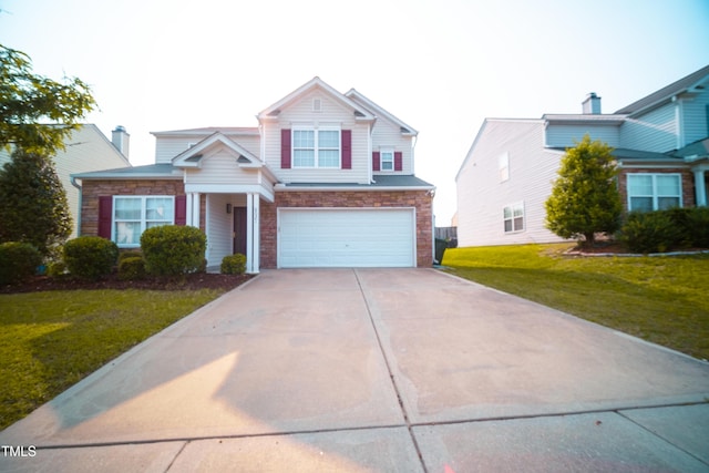8021 Wesley Farm Dr, Raleigh, NC 27616 - traditional-style house with concrete driveway, a garage, and a front yard
