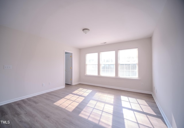 8021 Wesley Farm Dr, Raleigh, NC 27616 - empty room featuring wood finished floors and baseboards