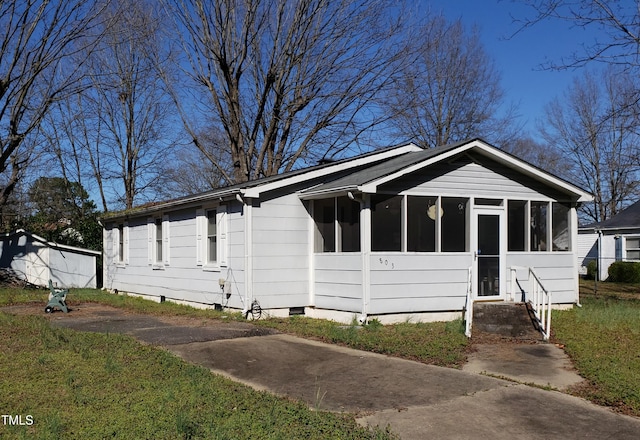 803 Hare St, Selma, NC 27576 - view of front facade featuring a sunroom and crawl space