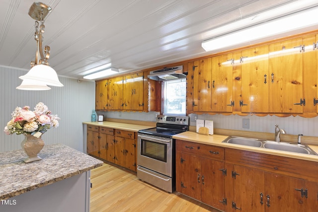 803 Hare St, Selma, NC 27576 - kitchen featuring electric stove, light countertops, light wood-style flooring, under cabinet range hood, and brown cabinets