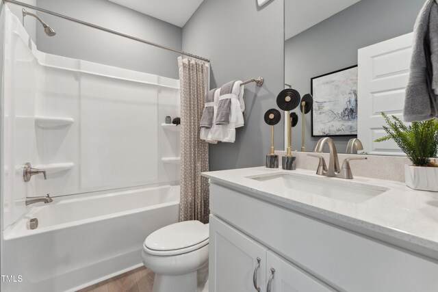144 N White St # 100, Wake Forest, NC 27587 - bathroom with shower / tub combo, toilet, vanity, and wood finished floors