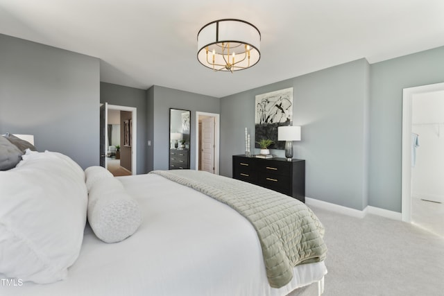 144 N White St # 100, Wake Forest, NC 27587 - carpeted bedroom with a chandelier and baseboards