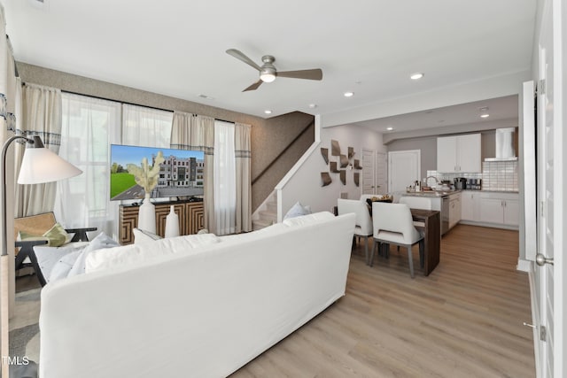144 N White St # 100, Wake Forest, NC 27587 - living area featuring stairway, ceiling fan, light wood-style floors, and recessed lighting