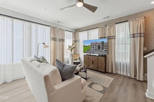 144 N White St # 100, Wake Forest, NC 27587 - living room featuring wood finished floors and ceiling fan