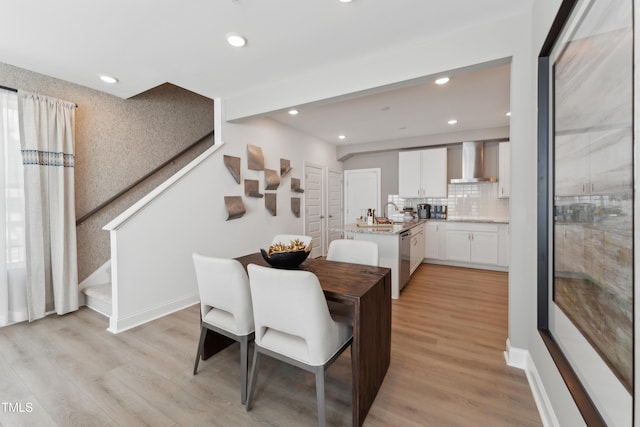 144 N White St # 100, Wake Forest, NC 27587 - dining area featuring stairs, recessed lighting, light wood-style floors, and baseboards