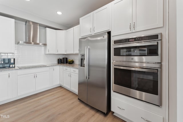 144 N White St # 100, Wake Forest, NC 27587 - kitchen with stainless steel appliances, wall chimney exhaust hood, white cabinetry, light stone counters, and recessed lighting