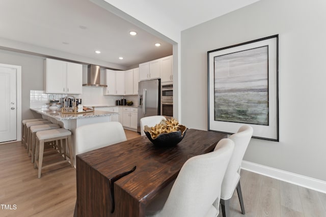 144 N White St # 100, Wake Forest, NC 27587 - dining space with recessed lighting, light wood-type flooring, and baseboards