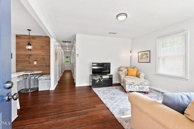 1207 Grant St, Durham, NC 27701 - living area with dark wood finished floors and baseboards