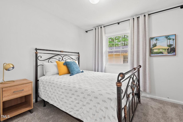1207 Grant St, Durham, NC 27701 - carpeted bedroom featuring baseboards