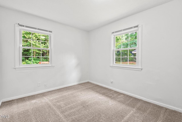 1207 Grant St, Durham, NC 27701 - spare room with baseboards and carpet floors