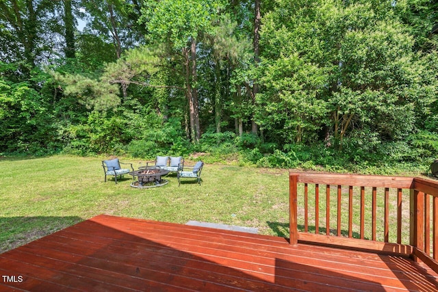 1207 Grant St, Durham, NC 27701 - wooden terrace featuring an outdoor fire pit and a lawn