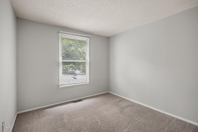 7731 Kingsberry Ct, Raleigh, NC 27615 - carpeted spare room featuring a textured ceiling and baseboards