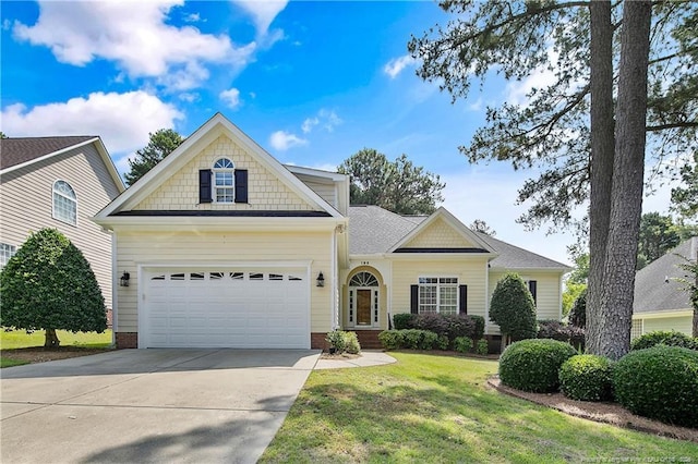 196 Leaning Pine Cir, Spring Lake, NC 28390 - view of front of house featuring concrete driveway, a front yard, and an attached garage