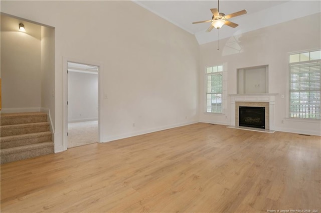 196 Leaning Pine Cir, Spring Lake, NC 28390 - unfurnished living room with plenty of natural light, light wood-type flooring, a ceiling fan, and high vaulted ceiling