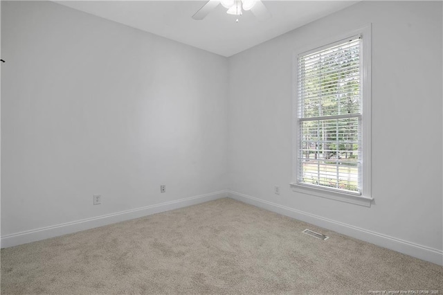 196 Leaning Pine Cir, Spring Lake, NC 28390 - spare room featuring carpet floors, ceiling fan, healthy amount of natural light, and baseboards