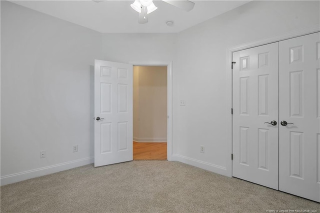 196 Leaning Pine Cir, Spring Lake, NC 28390 - unfurnished bedroom with carpet, baseboards, a closet, and ceiling fan