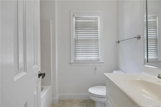 196 Leaning Pine Cir, Spring Lake, NC 28390 - full bath with baseboards, vanity, toilet, and healthy amount of natural light