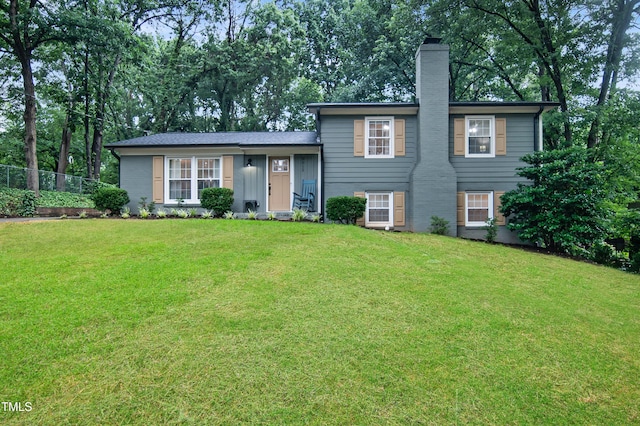 5012 Skidmore St, Raleigh, NC 27609 - split level home featuring a chimney