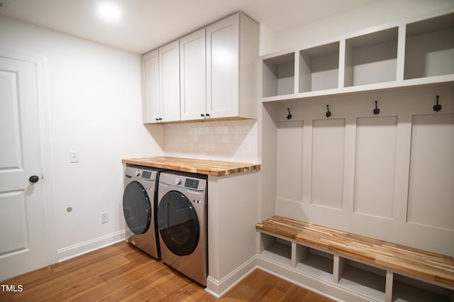 5012 Skidmore St, Raleigh, NC 27609 - laundry area with washing machine and dryer and light wood-type flooring
