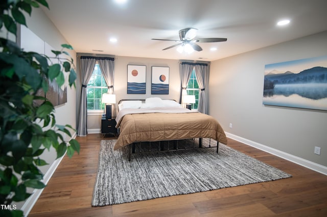 5012 Skidmore St, Raleigh, NC 27609 - bedroom with wood finished floors, multiple windows, recessed lighting, and ceiling fan