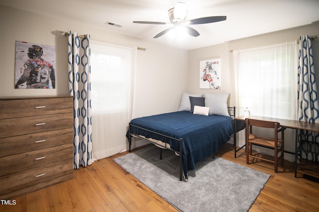 5012 Skidmore St, Raleigh, NC 27609 - bedroom featuring wood finished floors and a ceiling fan