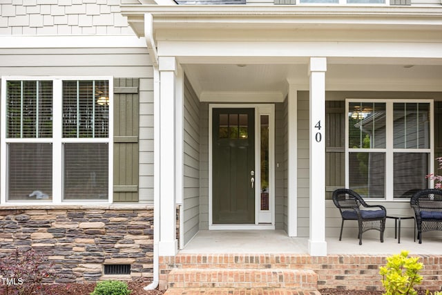 40 Yellowstone Ct, Youngsville, NC 27596 - doorway to property featuring a porch