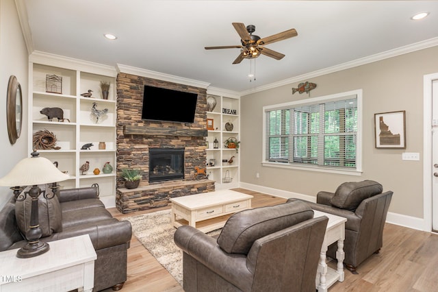 40 Yellowstone Ct, Youngsville, NC 27596 - living area with light wood-style floors, ceiling fan, baseboards, ornamental molding, and a stone fireplace