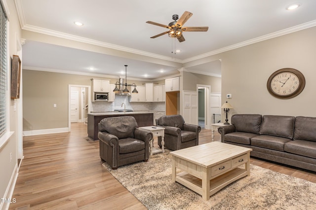 40 Yellowstone Ct, Youngsville, NC 27596 - living room with ceiling fan, light wood finished floors, ornamental molding, baseboards, and recessed lighting