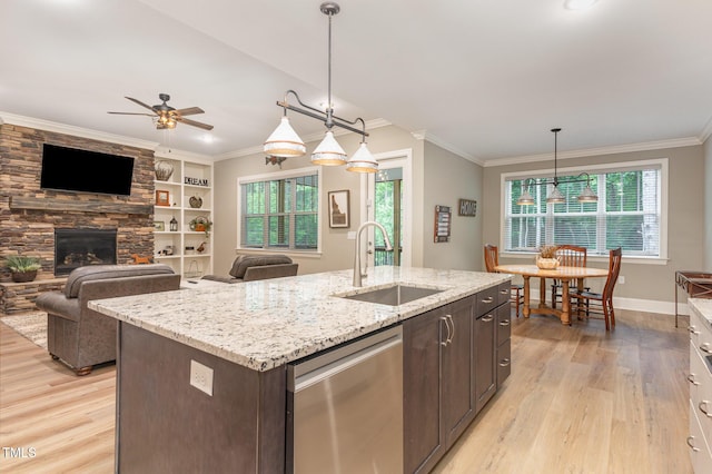 40 Yellowstone Ct, Youngsville, NC 27596 - kitchen with stainless steel dishwasher, a sink, light wood-style flooring, ornamental molding, and dark brown cabinets