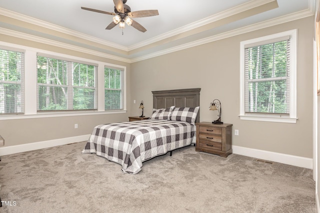 40 Yellowstone Ct, Youngsville, NC 27596 - carpeted bedroom with multiple windows, crown molding, baseboards, and ceiling fan