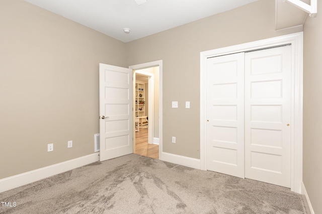 40 Yellowstone Ct, Youngsville, NC 27596 - unfurnished bedroom featuring carpet floors, baseboards, and a closet