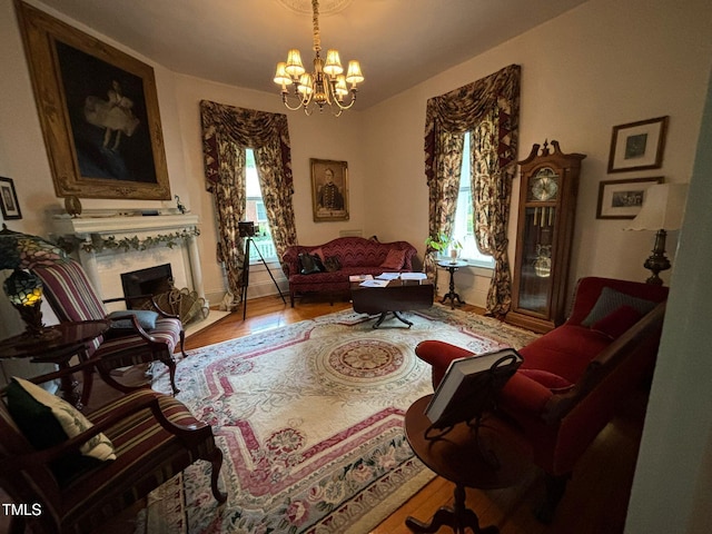 331 N Main St, Warrenton, NC 27589 - sitting room featuring plenty of natural light, wood finished floors, a chandelier, and a high end fireplace