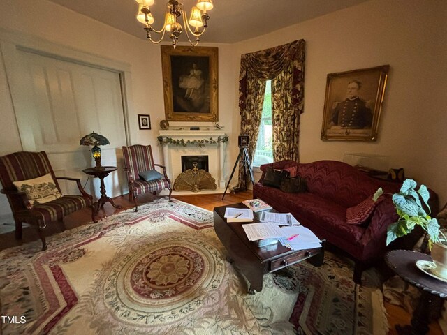 331 N Main St, Warrenton, NC 27589 - living room with a chandelier, a fireplace with flush hearth, and wood finished floors