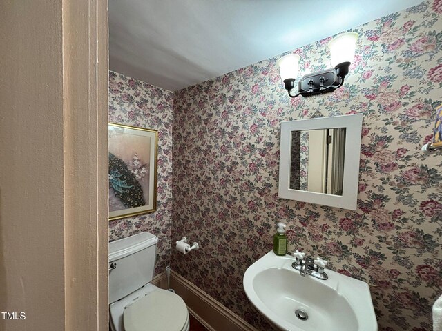 331 N Main St, Warrenton, NC 27589 - half bathroom featuring a sink and toilet