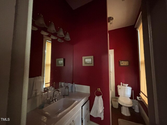 331 N Main St, Warrenton, NC 27589 - full bath with vanity, toilet, baseboards, and a shower