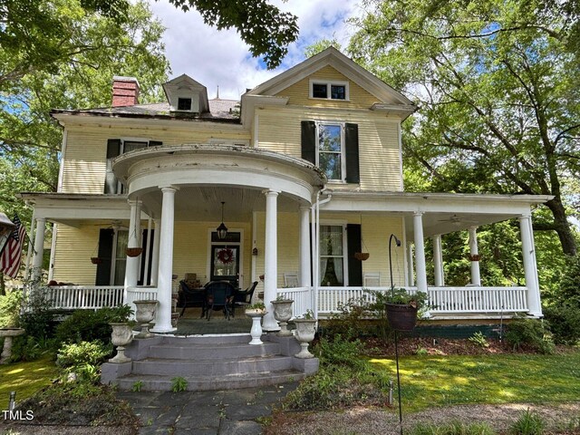 331 N Main St, Warrenton, NC 27589 - view of front of property featuring a porch and a chimney