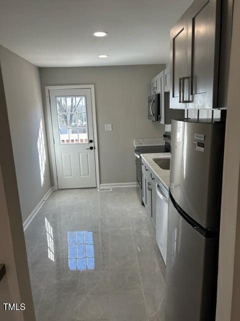 407 Bledsoe Ave, Raleigh, NC 27601 - kitchen featuring appliances with stainless steel finishes, recessed lighting, and light countertops