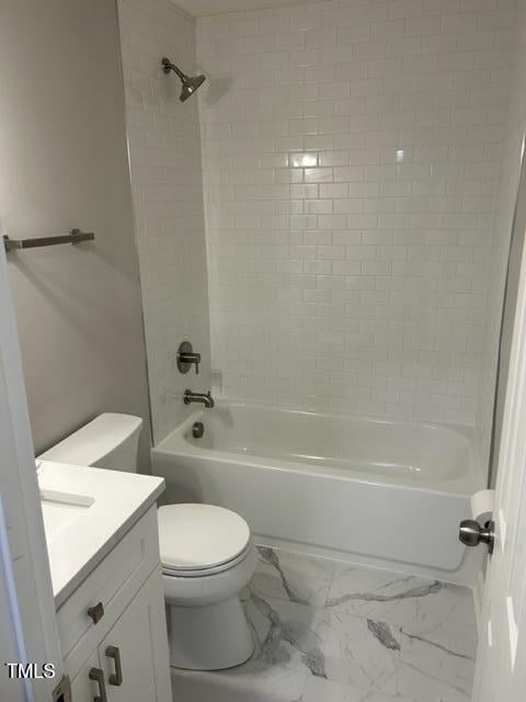407 Bledsoe Ave, Raleigh, NC 27601 - full bath featuring vanity, shower / bathtub combination, and marble look tile flooring