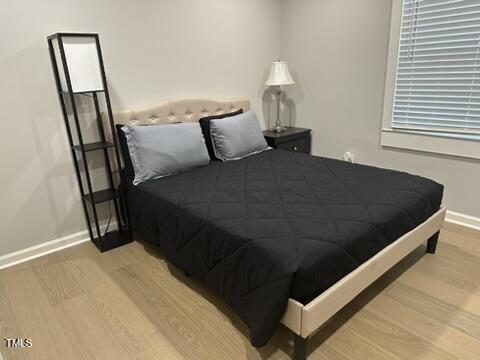 407 Bledsoe Ave, Raleigh, NC 27601 - bedroom with wood finished floors and baseboards