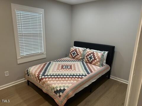 407 Bledsoe Ave, Raleigh, NC 27601 - bedroom with wood finished floors and baseboards
