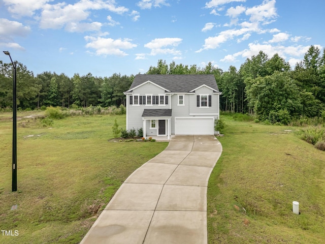 6044 Lowgrass Rd, Stedman, NC 28391 - traditional home featuring an attached garage, concrete driveway, a front lawn, and a wooded view