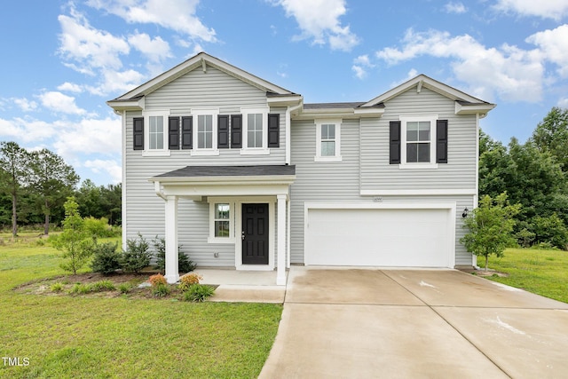 6044 Lowgrass Rd, Stedman, NC 28391 - view of front of home featuring a garage, driveway, and a front yard