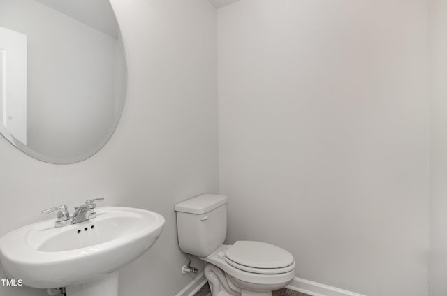 6044 Lowgrass Rd, Stedman, NC 28391 - bathroom with a sink, baseboards, and toilet