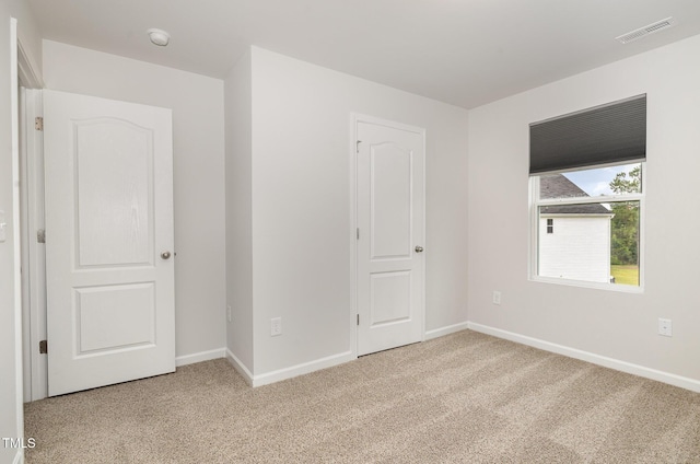 6044 Lowgrass Rd, Stedman, NC 28391 - unfurnished bedroom featuring light colored carpet and baseboards