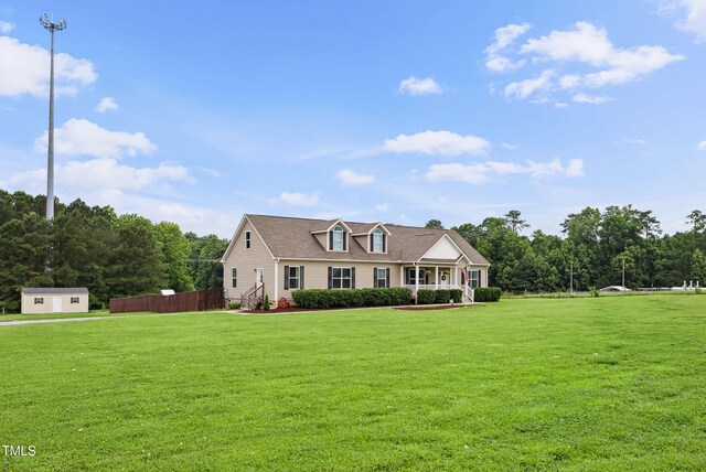 9300 Lake Wheeler Rd, Fuquay Varina, NC 27526 - new england style home featuring a front yard and an outdoor structure